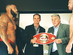 From left: Eric (The Hammer) Martel-Bahoeli, promoter Les Woods, boxing legend George Chuvalo and Dillon (Big Country) Carman at  Friday's weigh-in at the Real Sports Bar & Grill. Martel-Bahoeli and Carman are set to slug it out for the Canadian heavyweight championship at the Mattamy Centre on Saturday. (GLOBAL LEGACY BOXING)