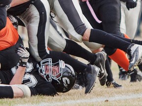 Connor Cook, Whitecourt Cats, gets piled on during a game against the Grande Prairie Warriors at Graham Acres field in Whitecourt, on Friday, Oct. 17. The Whitecourt Cats defeated Grande Prairie 66 - 7.
Adam Dietrich | Whitecourt Star photo