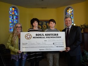 Remembering Nelly - bereavement counselor Cheryl Salter-Roberts (left) joins Christine Vachon (Nelly's mom), her grandson Blair Lobsinger, and Danny Hooper at Pilgrims Hospice for the presentation of a $102,810 cheque, money that was raised during a recent fundraising event in Westlock in support of mental health and suicide prevention. PHOTO CREDIT: Les Dunford