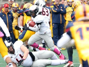 Carleton Ravens running back Jahvari Bennett moves the ball up the field Saturday as Carleton hosted the Queen's Gaels at Keith Harris Stadium. (Chris Hofley/Ottawa Sun)