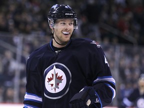 Jets defenceman Paul Postma wasn't smiling a year ago. (KEVIN KING/Winnipeg Sun files)