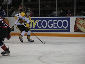 Pavel Zacha of the Sarnia Sting carries the puck into the Ottawa 67's zone before firing a slap shot at goalie Leo Lazarev. Defenceman Taylor Davis blocks the passing lane. (TERRY BRIDGE/THE OBSERVER)