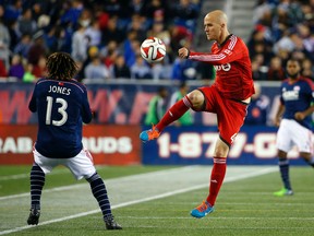 TFC's Michael Bradley clears the ball against the New England Revolution during Saturday night's game. (USA TODAY SPORTS)