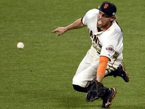 San Francisco Giants right fielder Hunter Pence makes a catch on a ball hit by Kansas City Royals outfielder Lorenzo Cain (not pictured) in the 9th inning during game four of the 2014 World Series at AT&T Park on October 25, 2014. (Ed Szczepanski/USA TODAY Sports)