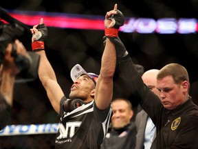 Jose Aldo (red gloves) celebrates beating Ricardo Lamas (blue gloves) during UFC 169 at Prudential Center Feb. 1, 2014. (Joe Camporeale/USA TODAY Sports)