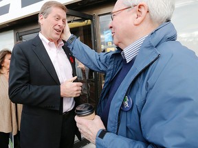 John Tory (left) receives the endorsement of former Toronto mayor David Crombie at Bagel World on Wilson Ave. in North York on Sunday, October 26, 2014. (Michael Peake/Toronto Sun)