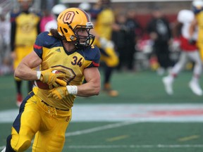 Queen's Golden Gaels running back Jesse Andrews moves the ball against the Carleton Ravens on Saturday afternoon at Keith Harris Stadium in Ottawa. (Chris Hofley/QMI Agency)