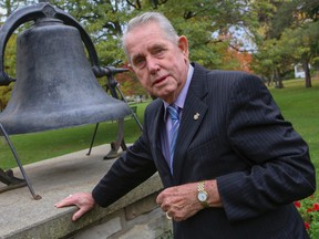 Milton Mayor Gord Krantz, 77, with the town bell dated 1865, on Oct. 17, 2014. (Dave Thomas/Toronto Sun)