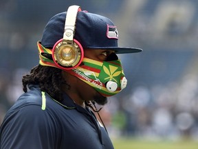 Running back Marshawn Lynch #24 of the Seattle Seahawks warms up before the game against the Dallas Cowboys at CenturyLink Field on October 12, 2014 in Seattle, Washington. (Steve Dykes/Getty Images/AFP)