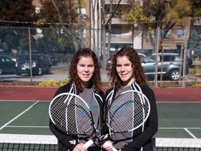 Twin sisters Clara Rastin, left, and Catherine Rastin are heading to OFSAA in girls doubles tennis after winning their third-straight SWOSSAA title. They defeated three Windsor schools to defend their championship. (TERRY BRIDGE/THE OBSERVER)