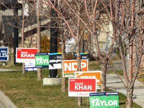 Election signs for Calgary-West candidates are shown near 17 Ave. and Aspen Summit Drive S.W. Calgarians head to the polls in three ridings for byelections Monday along with one in Edmonton. Jim Wells/Calgary Sun/QMI Agency