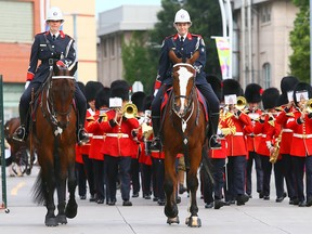 The Toronto Police Mounted Unit leads the parade during the opening ceremonies of the CNE in Toronto on Friday, August 15, 2014. (Dave Abel/Toronto Sun)