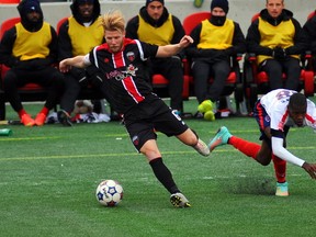 Fury captain Ritchie Ryan battles for the ball with Indy Eleven defender Fejiro Okiomah on Sunday afternoon at TD Place. Indy won the match 2-1. DEAN JONCAS/PHOTO