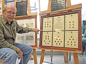 Richard Weigand showing a collection of "Precancelled Postage Stamps of Kingston," with local stamps dating back to the beginning of the 20th Century. (Sam Cooley/For The Whig-Standard)
