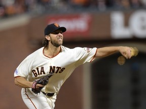 San Francisco Giants starting pitcher Madison Bumgarner throws against the Kansas City Royals during the eighth inning of Game 5 of the World Series on Sunday night. (USA TODAY Sports)