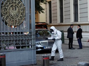 >A member of Turkey's disaster management agency (AFAD) disinfects the garden of the German consulate in Istanbul October 24, 2014. Turkish authorities on Friday launched an investigation after an unidentified yellow powder was found in a package sent to the Canadian consulate in Istanbul. The German and Belgian consulates also received similar packages containing the yellow powder, Turkish media reported.  REUTERS/Osman Orsal