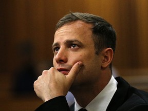 A file picture taken on October 16, 2014 shows South African paralympic athlete Oscar Pistorius waiting before his sentencing hearing at the North Gauteng High Court in Pretoria. South African state prosecutors said on October 27, 2014 they would appeal a culpable homicide verdict and five year jail term handed down to fallen track star Oscar Pistorius. (AFP PHOTO / POOL / SIPHIWE SIBEKO)