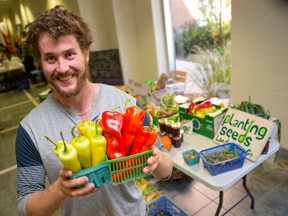 Kyle Hutcheson, founder of Planting Seeds Co., sells vegetables and plant seeds at a stall promoting health and the ease with which one can grow their own food in Fanshawe College in London on Thursday October 23, 2014. (CRAIG GLOVER, The London Free Press)