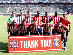 Chivas USA poses for a pregame tam photo in front of a sign thanking fans for 10 years of support before playing the San Jose Earthquakes at StubHub Center on October 26, 2014 in Los Angeles, California.  (Stephen Dunn/Getty Images/AFP)