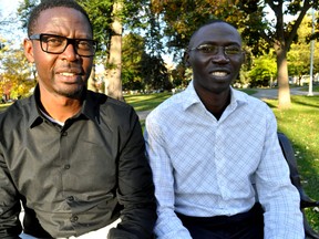 Allan Ssemugenyi (left) and Lubali Ronald Hope in London Ont.’s Victoria Park October 22, 2014. CHRIS MONTANINI\LONDONER\QMI AGENCY