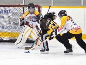 Avree Paulen (92) of the Mitchell U14A ringette team drives hard to the net during WORL regular season action last Thursday, Oct. 23 against Waterloo. The Stingers won, 5-4. ANDY BADER/MITCHELL ADVOCATE