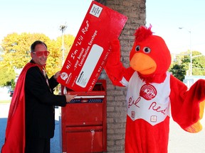 Chatham-Kent United Way co-chair Dean Muharrem and United Way's L'il Red Mascot team up to remind people about the United Way's annual direct mail campaign is beginning.