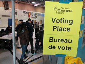 Voters arrive to vote during the Ontario election at Ecole elementary le Prelude in Orleans Monday Oct 27,  2014.  Tony Caldwell/Ottawa Sun/QMI Agency