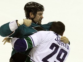 San Jose Sharks John Scott (20) fights with Vancouver Canucks Tom Sestito (29) in a first period fight during their  NHL Preseason game at the Stockton Arena on Sep 23, 2014 in Stockton, CA, USA. (Lance Iversen-USA TODAY Sports)