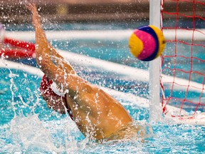Romania's Mihai Dragusin is scored on during Team Romania's quarter final Olympic qualifying water polo match against Team Brazil at the Kinsmen Sports Centre in Edmonton, Alta. on Friday, April 6, 2012. Codie McLachlan/Edmonton Sun
