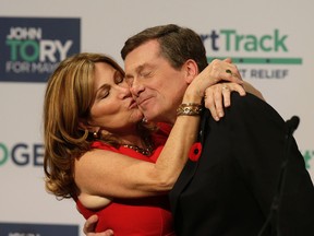 John Tory gets a kiss from his wife, Barbara Hackett, after being elected mayor of Toronto on Oct. 27, 2014. (Craig Robertson/Toronto Sun)