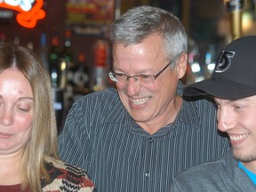 Jeff Wesley looks at the election results roll in on Oct. 27 at Crabby Joe's in Wallaceburg, as his daughter-in-law Jessica Wesley and son Kyle Wesley look on. Wesley was the top vote-getter by a large margin in Ward 5 (Wallaceburg) for the second straight election.
DAVID GOUGH/ QMI Agency