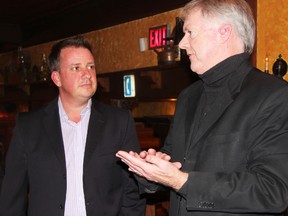 Jason McMichael, former first vice-president of the Customs and Immigration Union, stopped by to congratulate Sarnia Mayor Mike Bradley on his successful campaign at Paddy Flaherty's Monday night. Bradley will now hold the title of second-longest serving mayor currently in the province of Ontario. BARBARA SIMPSON/THE OBSERVER/QMI AGENCY