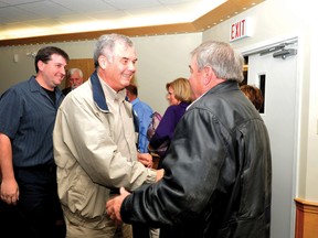 Acclaimed Elizabethtown-Kitley Township mayor Jim Pickard, centre, shakes the hand of re-elected councillor Earl Brayton. On the left is newcomer councillor Jason Barlow, who was the highest vote-getter in the township (ALANAH DUFFY/The Recorder and Times).