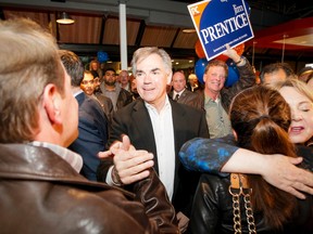 Jim Prentice arrives at Moo's Healthy Food Fast, his post-byelection campaign headquarters in Calgary, Alta., on Monday, Oct. 27, 2014. Prentice won his seat in a Calgary-Foothills by-election in a landslide. Lyle Aspinall/Calgary Sun/QMI Agency