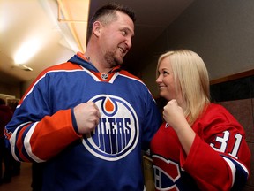Warren Moore and Jada Jones defend their teams’ honours prior to the Edmonton Oilers and Montreal Canadiens game at Rexall Place on Oct. 27. Photo by David Bloom/QMI Agency
