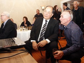 Newly-elected city councillor Mike Graham, centre, speaks with his campaign manager, former councillor Tom Lafferty at Capers Restaurant in downtown Belleville, Ont. Monday, Oct. 27, 2014. - JEROME LESSARD/THE INTELLIGENCER/QMI AGENCY