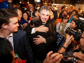 Jim Prentice arrives at Moo's Healthy Food Fast, his post-byelection campaign headquarters in Calgary, Alta., on Monday, Oct. 27, 2014. Prentice won his seat in a Calgary-Foothills by-election in a landslide. Lyle Aspinall/Calgary Sun/QMI Agency