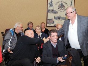 Councillor-elect Phil Deery, left, the only newcomer in the newly-elected city council, is greeted by councillor Jeff Earle in the council chambers Monday night. Between them is Deery's campaign manager, Matt Wren. (RONALD ZAJAC/The Recorder and Times)