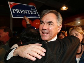 Alberta Premier Jim Prentice is greeted by supporters after he was elected in the Calgary Foothills riding in Calgary, Alberta, October 27, 2014.  REUTERS/Todd Korol