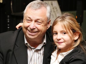 Gino Donato/The Sudbury Star
Mayoral candidate and current city councillor Ron Dupuis shares a moment with his 8-year-old granddaughter Mia at his election night celebration at Ferrigan's Pub in Garson.