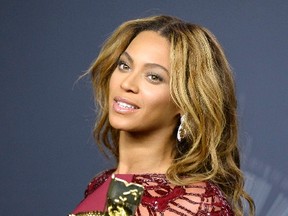 Singer Beyonce smiles backstage during the 2014 MTV Video Music Awards in Inglewood, California August 24, 2014.  REUTERS/Kevork Djansezian