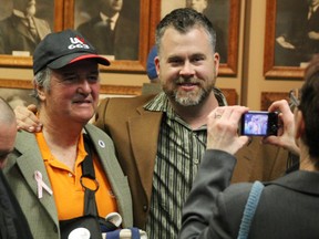 City/county candidate Joe Hill poses for a photo with new city councillor Brian White at Sarnia City Hall Monday night. White joins Cindy Scholten and Matt Mitro as new city councillors. TYLER KULA/THE OBSERVER/QMI AGENCY