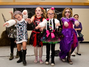 Leia Calaiezzi, Rayne Burkholder, Brooke Trepanier, and Callie McNabb get scary at the 2nd Annual Halloween Family Dance held last Friday at the Tim Horton Event Centre with proceeds going to the Cochrane Great Whites swim club.