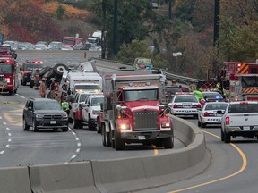 A dumptruck flipped and lost a load of gravel on the Don Valley Pkwy. around 1:30 p.m. on Tuesday, affecting north and southbound lanes. (JOHN HANLEY/Special to the Toronto Sun)