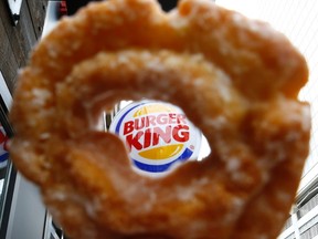 Burger King as seen through a hole in a Tim Hortons doughnut. 

REUTERS/Chris Helgren