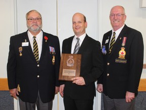 Branch 109 president Paul Thorne and Royal Canadian Legion Zone C1 commander Larry Bailey presented Goderich Signal Star publisher John Bauman with the Friends of Branch 109 Award. (Dave Flaherty/Goderich Signal Star)