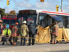 Toronto emergency crews at the scene of a fatal accident of an elderly woman who was struck around 10:30 a.m. by a westbound TTC bus as she crossed Lawrence Ave. at Allen Rd. in Toronto on Friday October 10, 2014. (Dave Thomas/Toronto Sun)