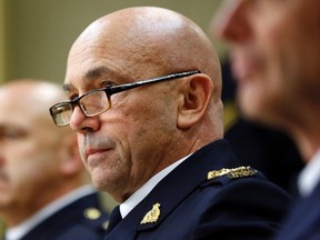 Royal Canadian Mounted Police Commissioner Bob Paulson (C) prepares to testify before a Senate committee in Ottawa October 27, 2014. (REUTERS/Blair Gable)