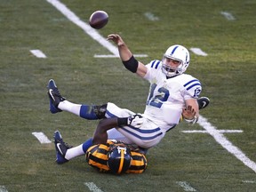 Indianapolis Colts quarterback Andrew Luck gets rid of the ball while under pressure from Pittsburgh Steelers inside linebacker Lawrence Timmons during the second quarter at Heinz Field on Oct. 29