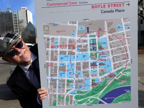 City Councillor Scott McKeen checks out the new map from the City's Walk Edmonton project during a news conference at the Winspear Centre in Edmonton, Alberta on Monday, Apr 14, 2014.  Perry Mah/ Edmonton Sun